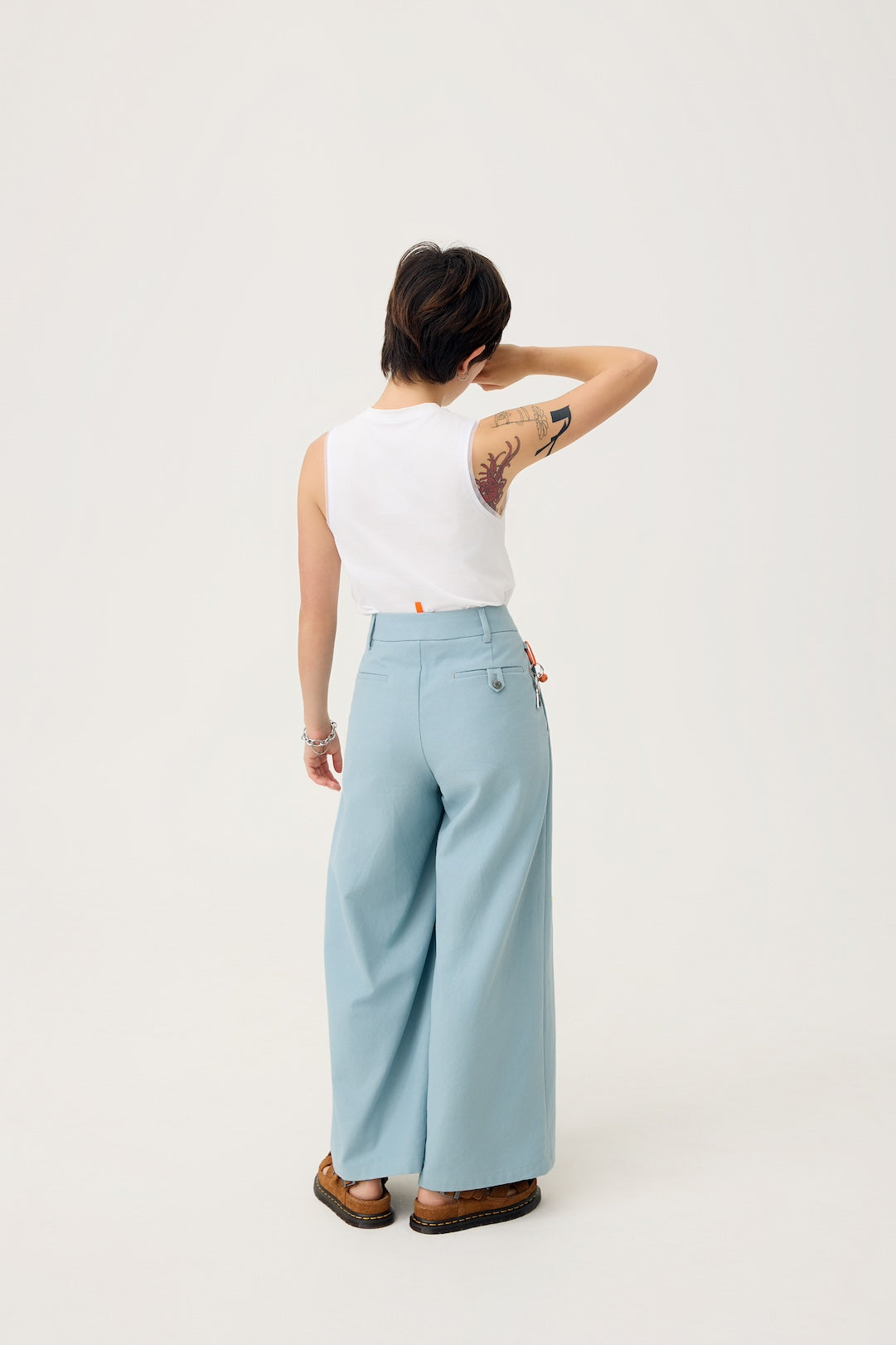 NAGARE PLEAT TROUSERS IN STEEL BLUE
