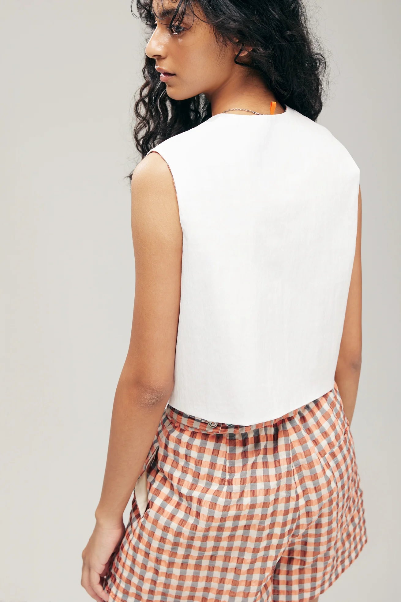 KAGAMI REVERSIBLE VEST IN ORANGE METALLIC SEERSUCKER & WHITE