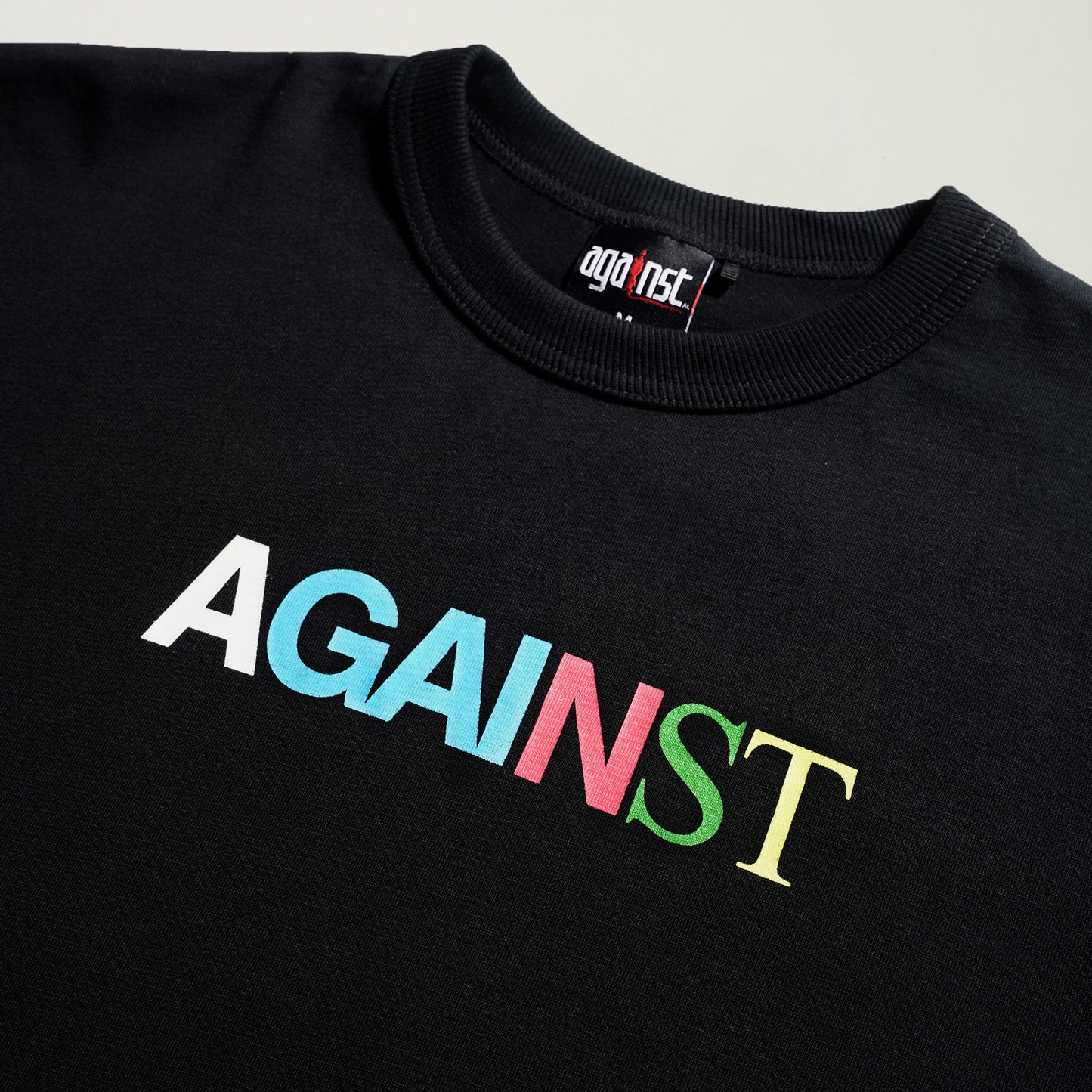 AGAINST X GOODTIMES ALL LOGO TEE BLACK