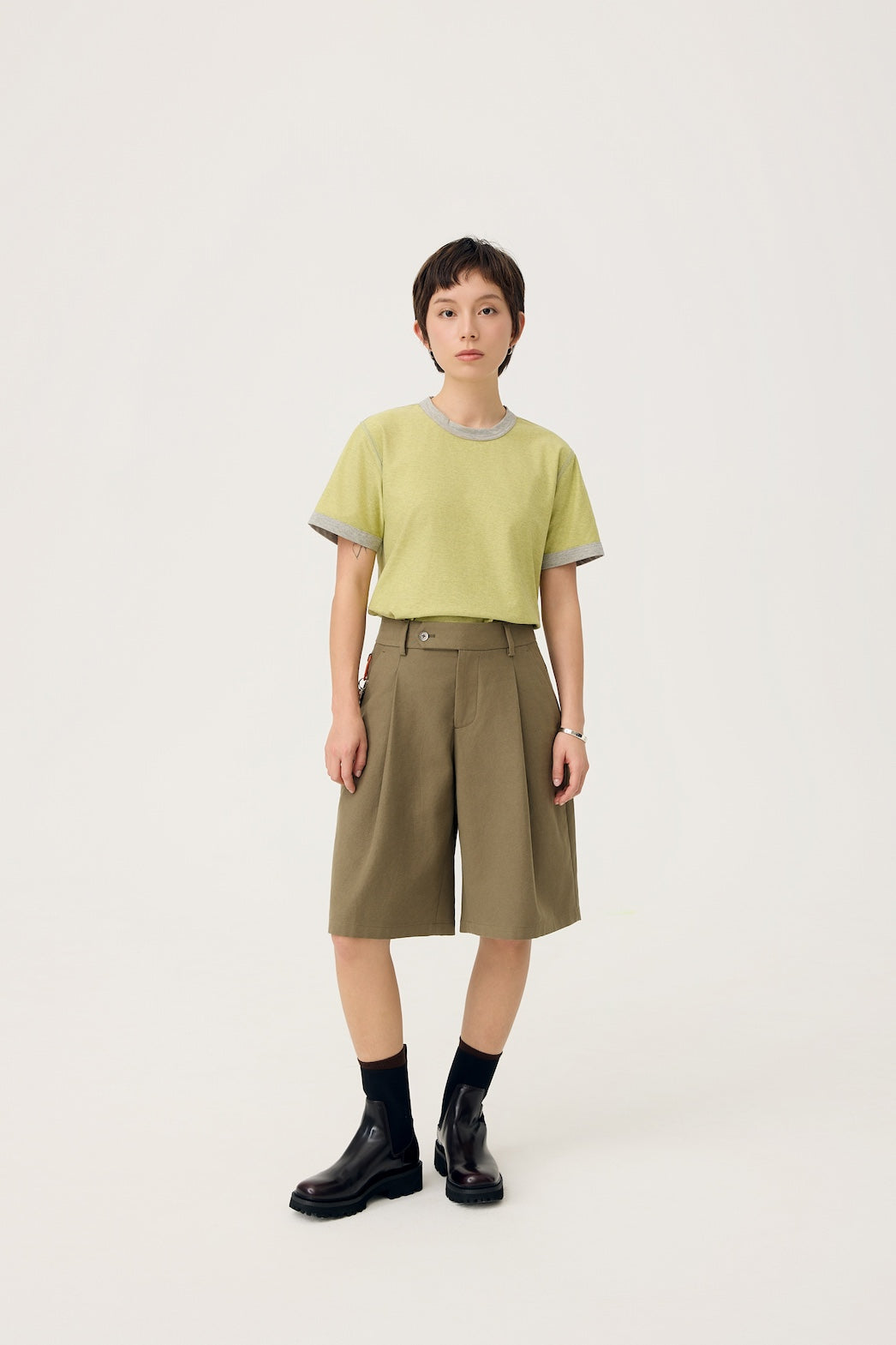 NAGI PLEAT SHORTS IN OLIVE MIST