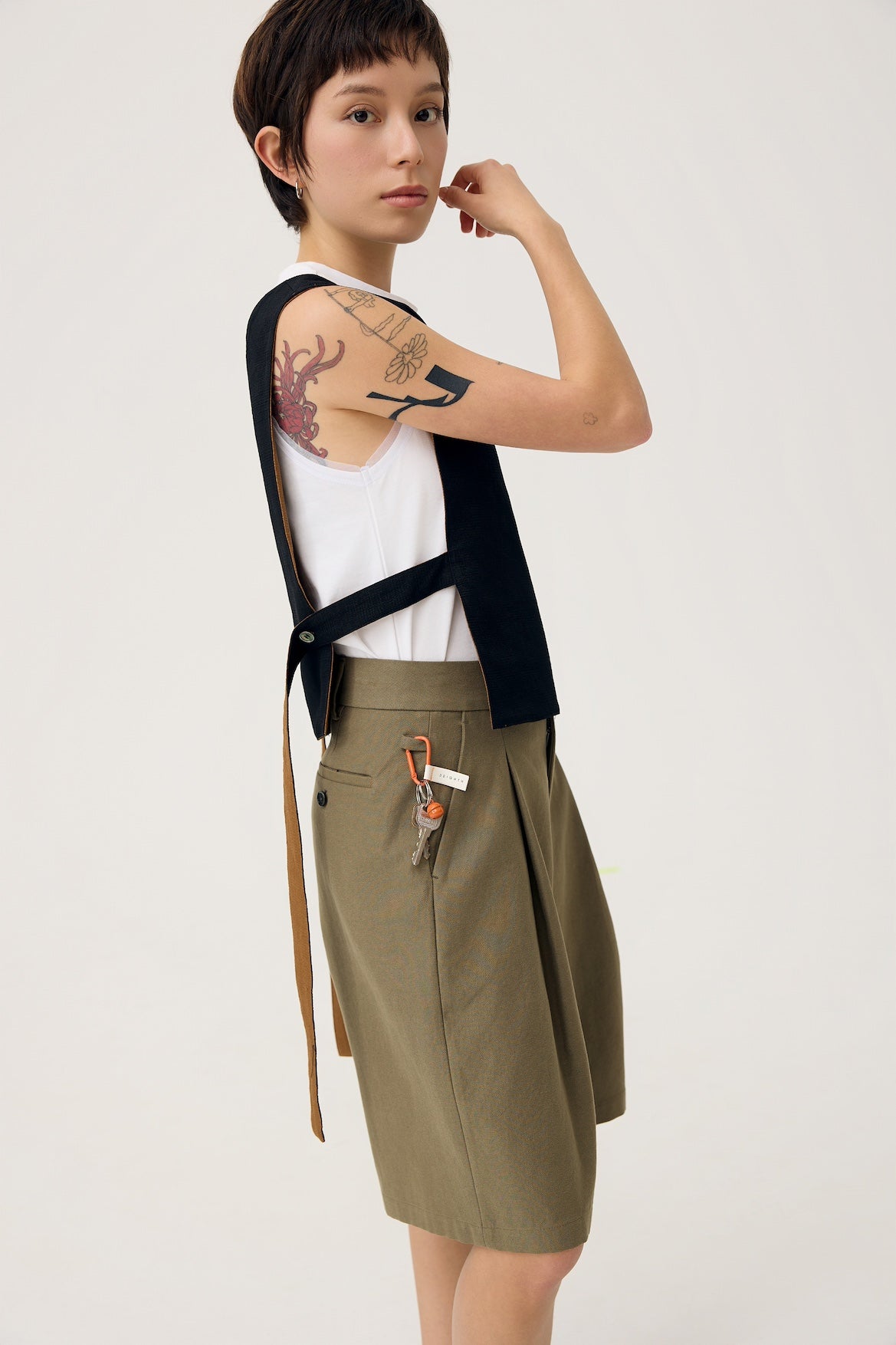 NAGI PLEAT SHORTS IN OLIVE MIST