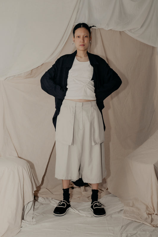 Asymmetrical Fly Pocket Pants In Cream